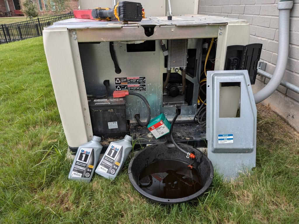 Generator in backyard with back compartment opened.